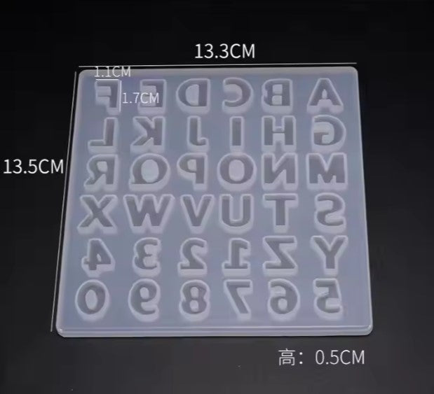 Transparent silicone mold with letters and numbers on a black background